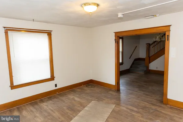 a bathroom with a sink a toilet and a a mirror