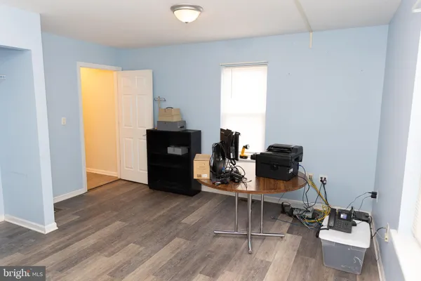 a view of an empty room and wooden floor