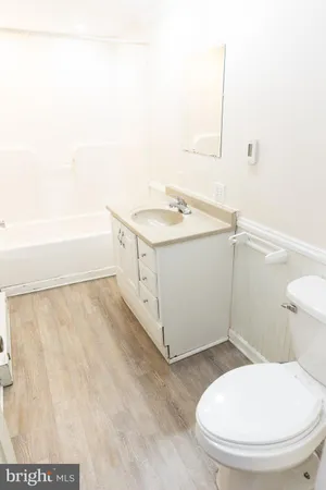 a view of a door with a door and wooden floor