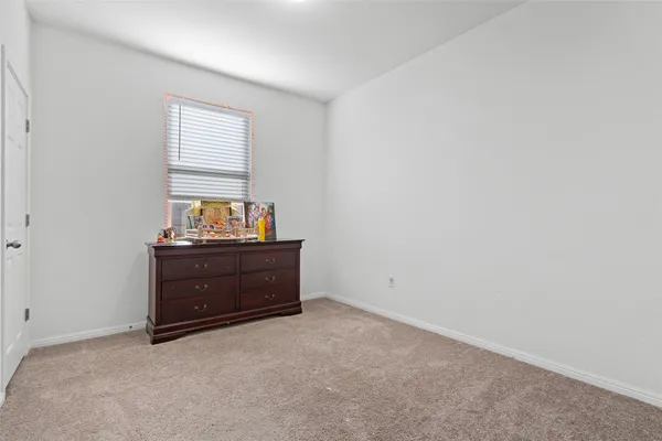 a room with window and cabinet