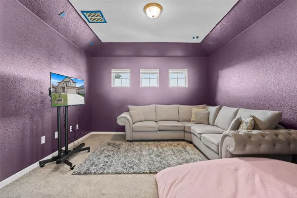 a living room with furniture and couch