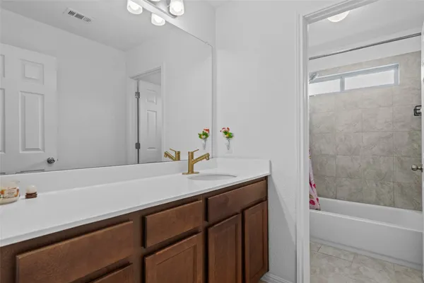 a bathroom with a sink and a bathtub