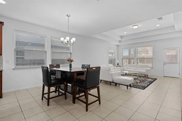 a view of a dining room with furniture and window