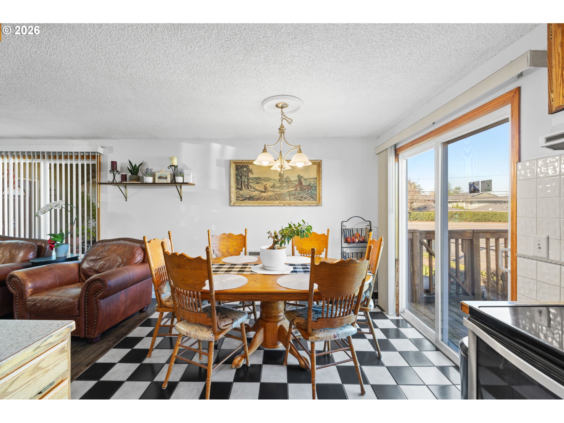 1480 Northeast Kane Drive Gresham, OR 97030 - Photo 11 of 46 a living room with furniture two window and a dining table