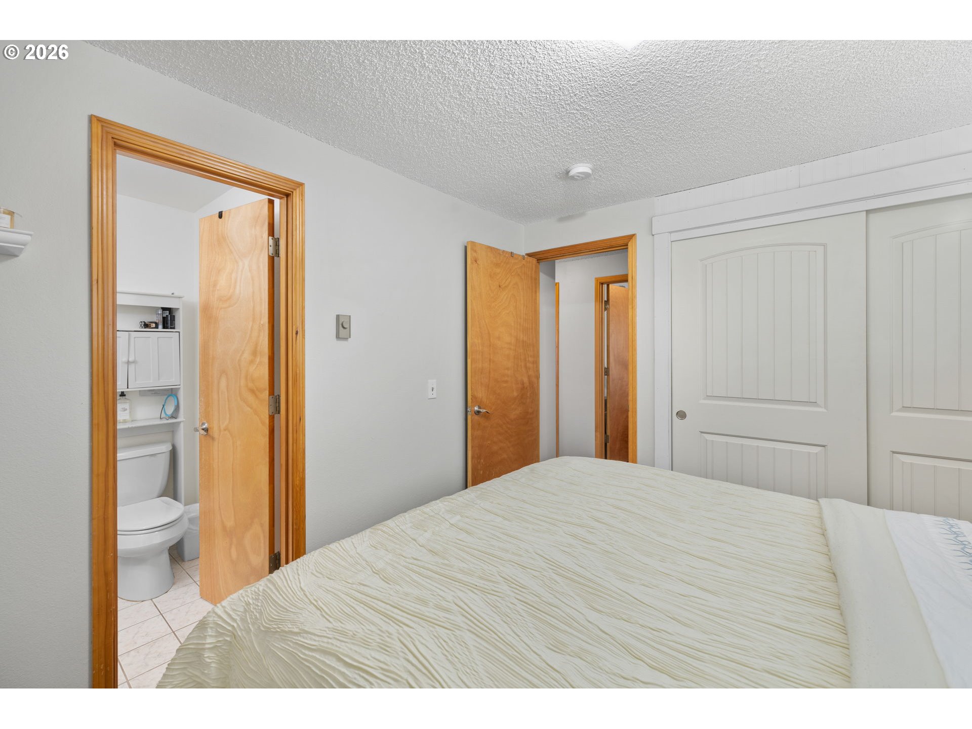 1480 Northeast Kane Drive Gresham, OR 97030 - Photo 13 of 46 a bedroom with a bed and a closet
