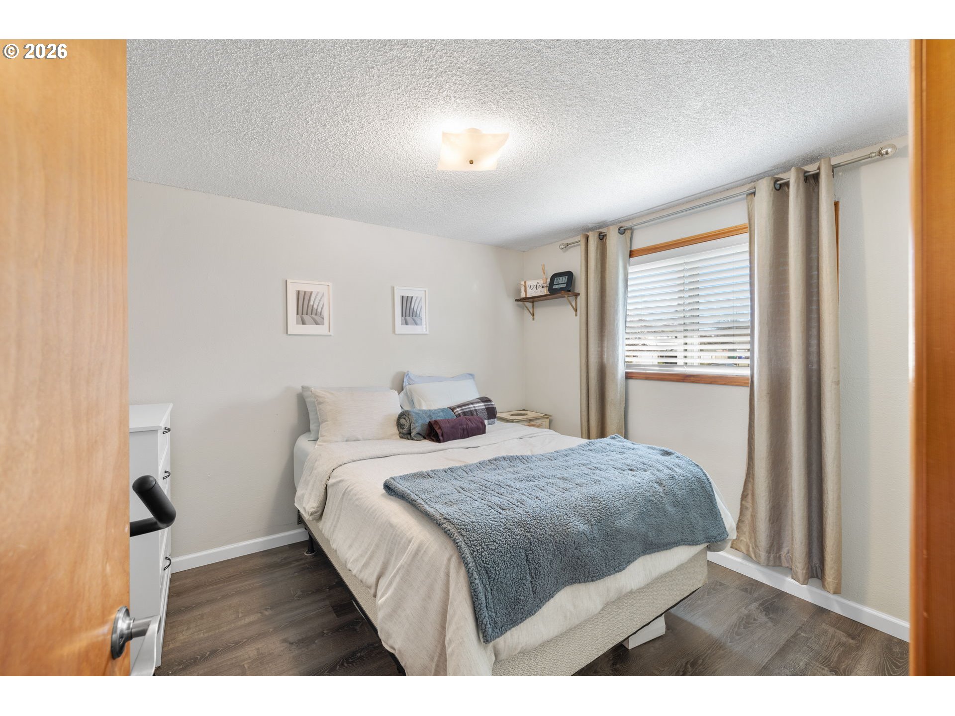 1480 Northeast Kane Drive Gresham, OR 97030 - Photo 16 of 46 a bedroom with a bed and a window
