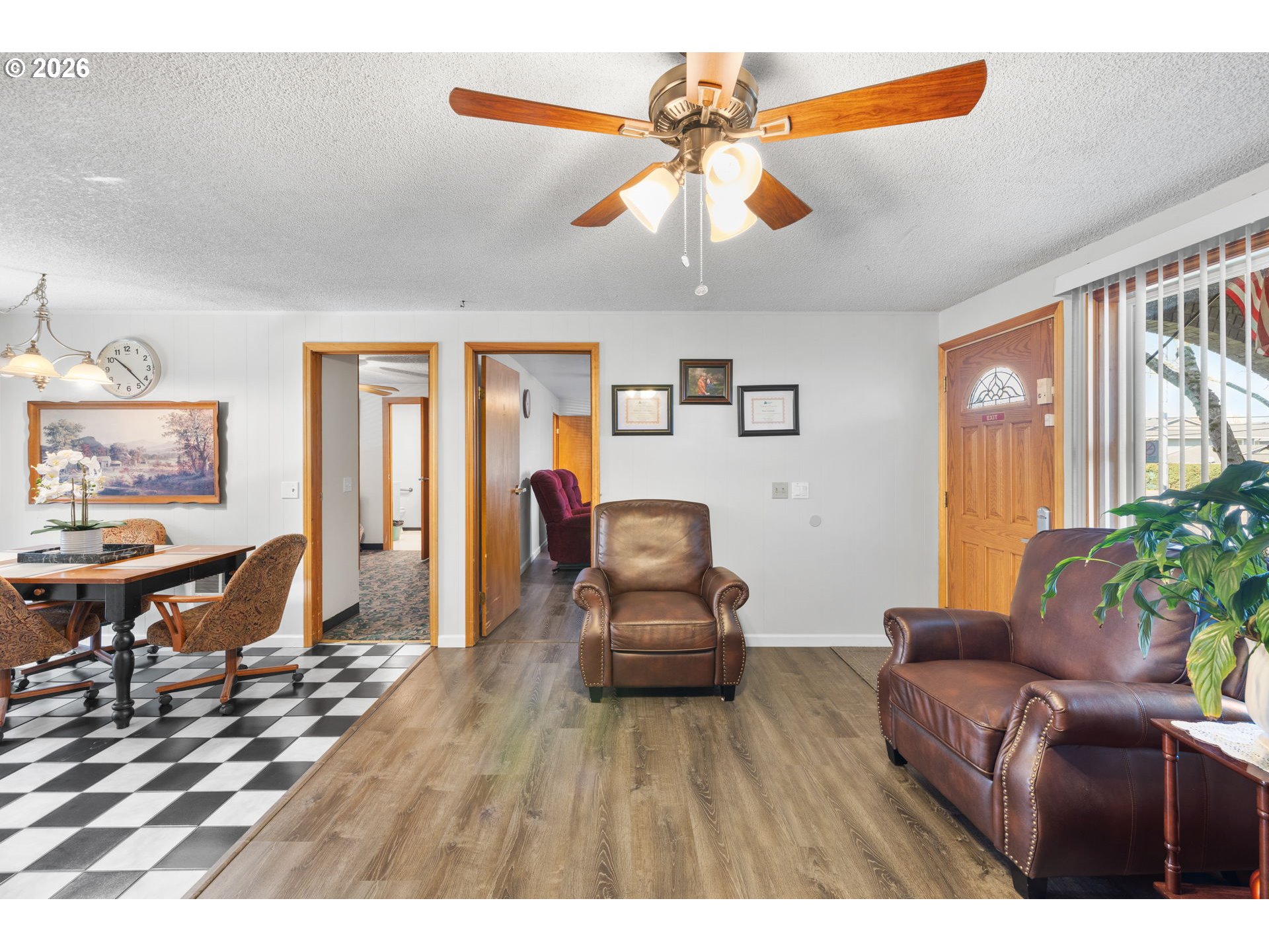 1480 Northeast Kane Drive Gresham, OR 97030 - Photo 19 of 46 a living room with furniture and a wooden floor