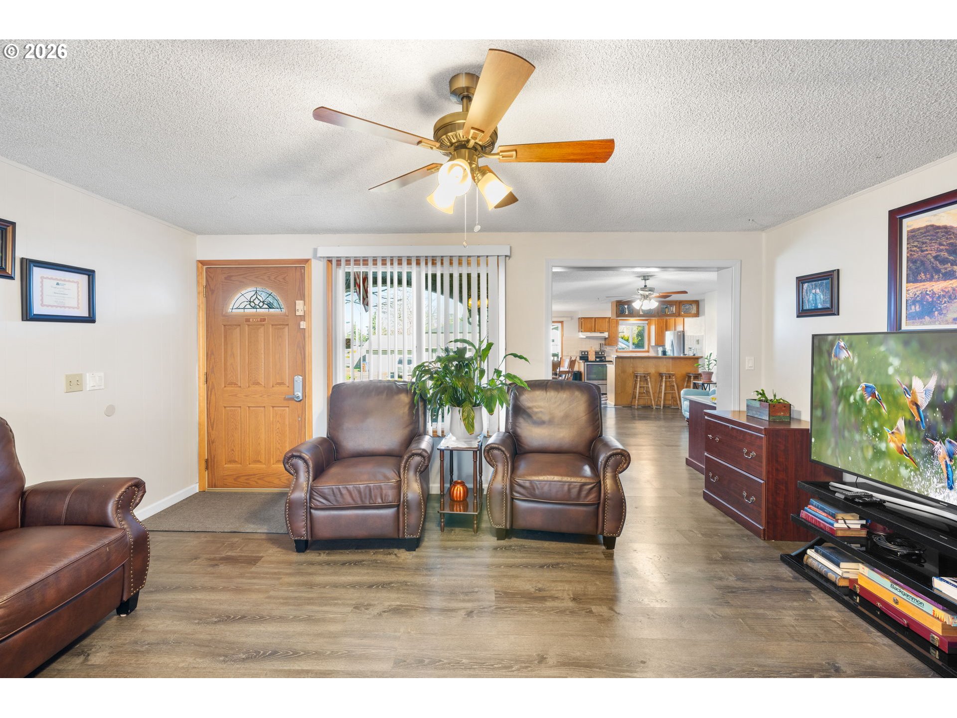 1480 Northeast Kane Drive Gresham, OR 97030 - Photo 21 of 46 a living room with furniture and a flat screen tv
