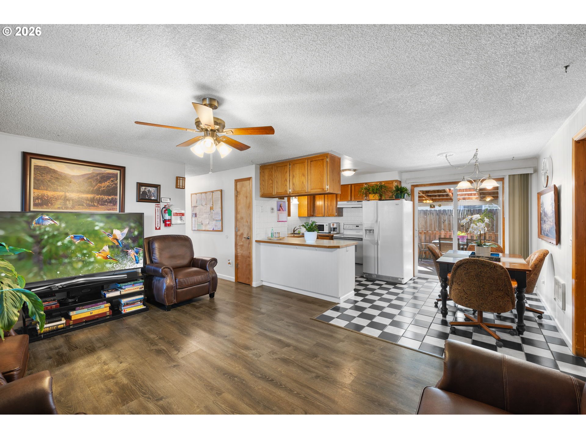 1480 Northeast Kane Drive Gresham, OR 97030 - Photo 22 of 46 a living room with furniture and a kitchen view