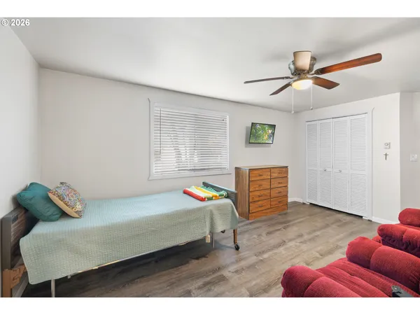 a bedroom with a bed and window