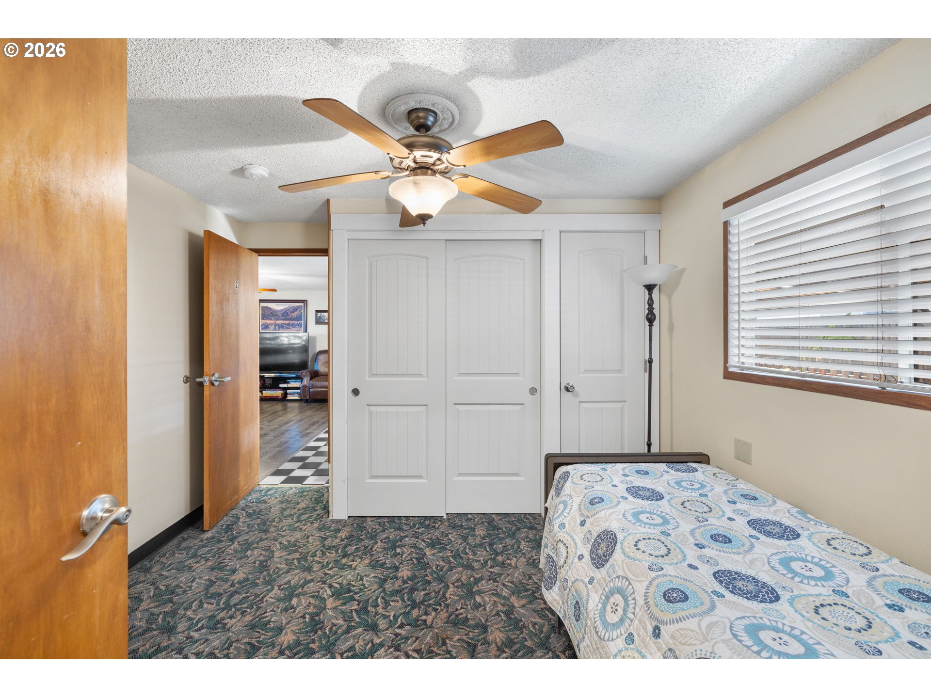 1480 Northeast Kane Drive Gresham, OR 97030 - Photo 31 of 46 a bedroom with a bed and a chandelier