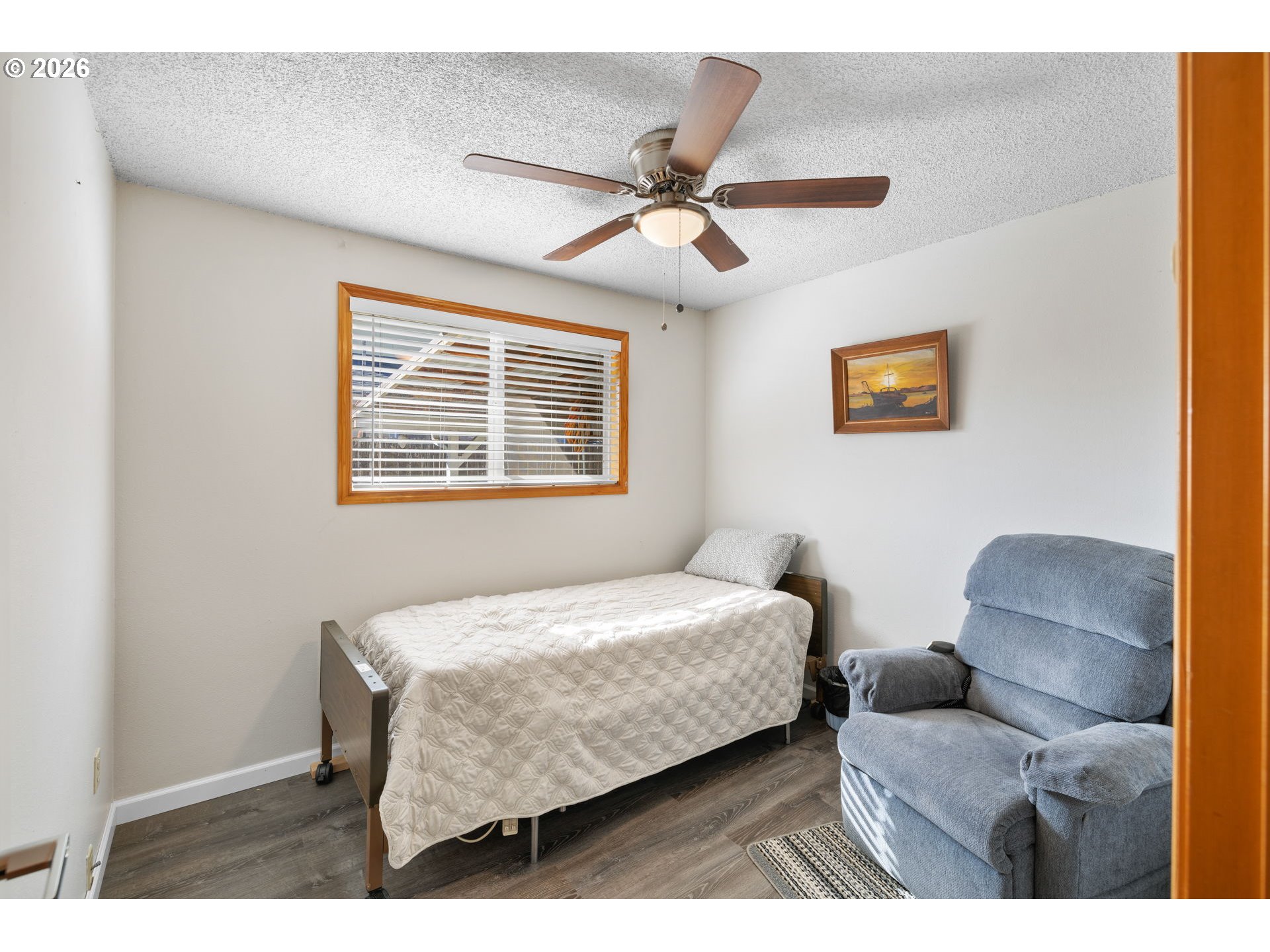 1480 Northeast Kane Drive Gresham, OR 97030 - Photo 35 of 46 a bedroom with a bed and a painting on the wall