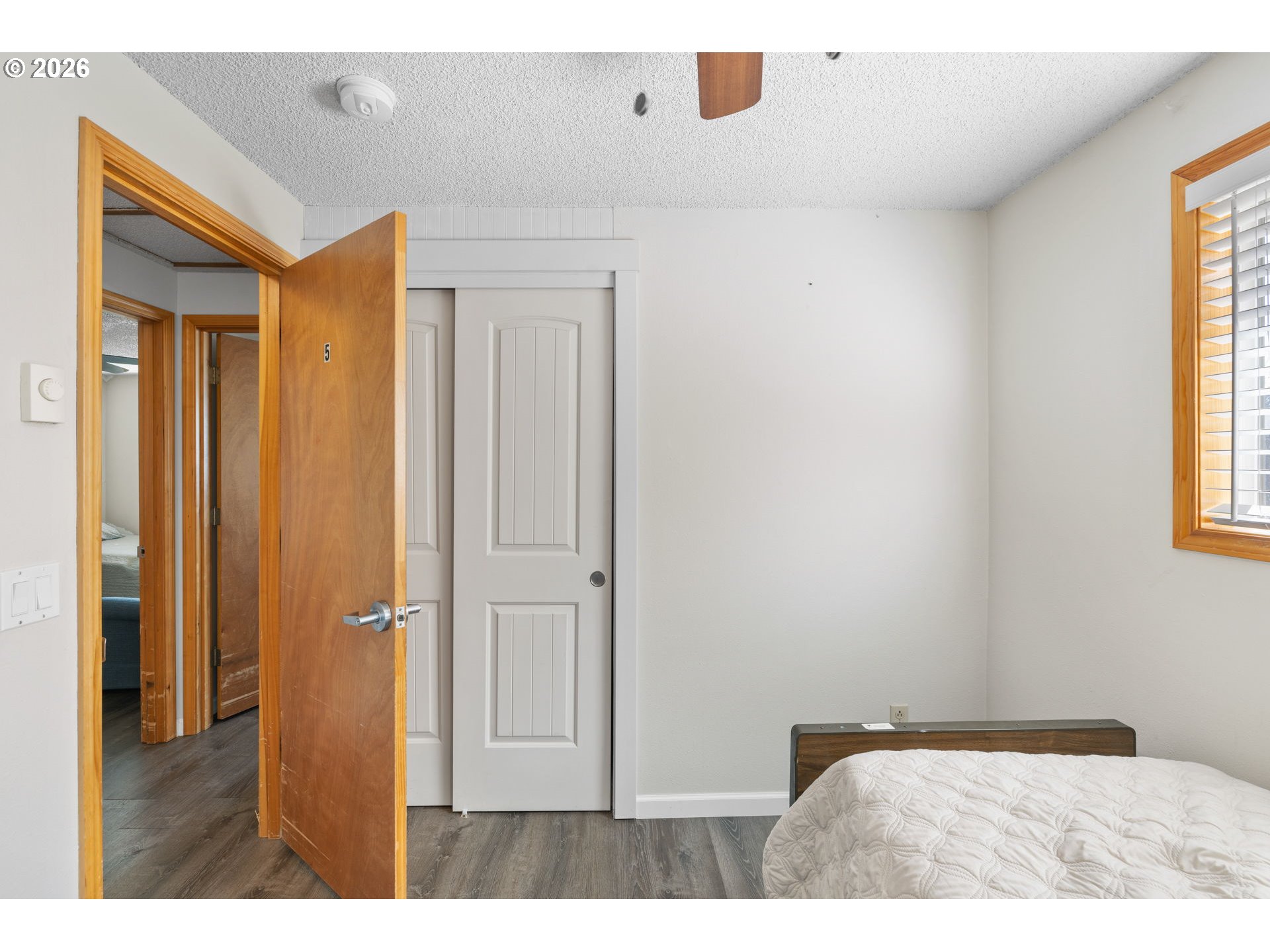 1480 Northeast Kane Drive Gresham, OR 97030 - Photo 36 of 46 a bedroom with a bed and a window