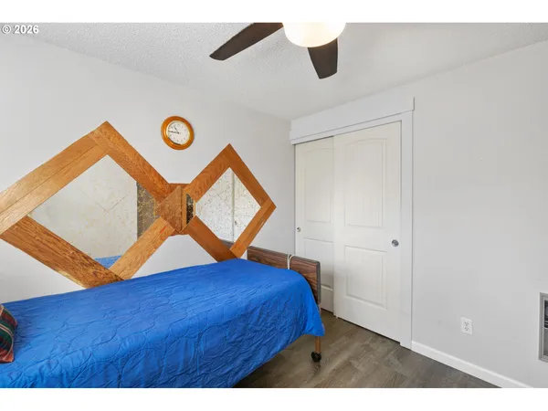 a bedroom with a bed and a dresser