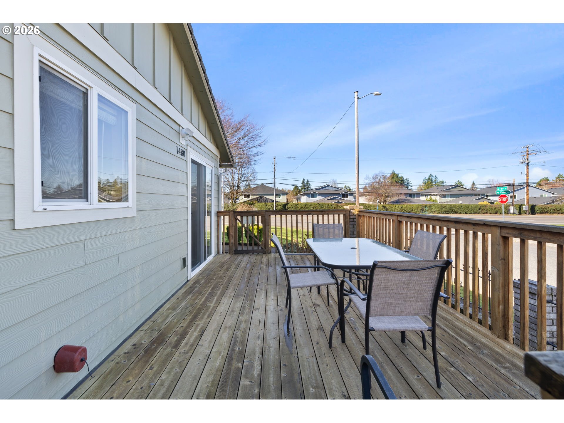 1480 Northeast Kane Drive Gresham, OR 97030 - Photo 44 of 46 a view of a deck with table and chairs with wooden floor and fence