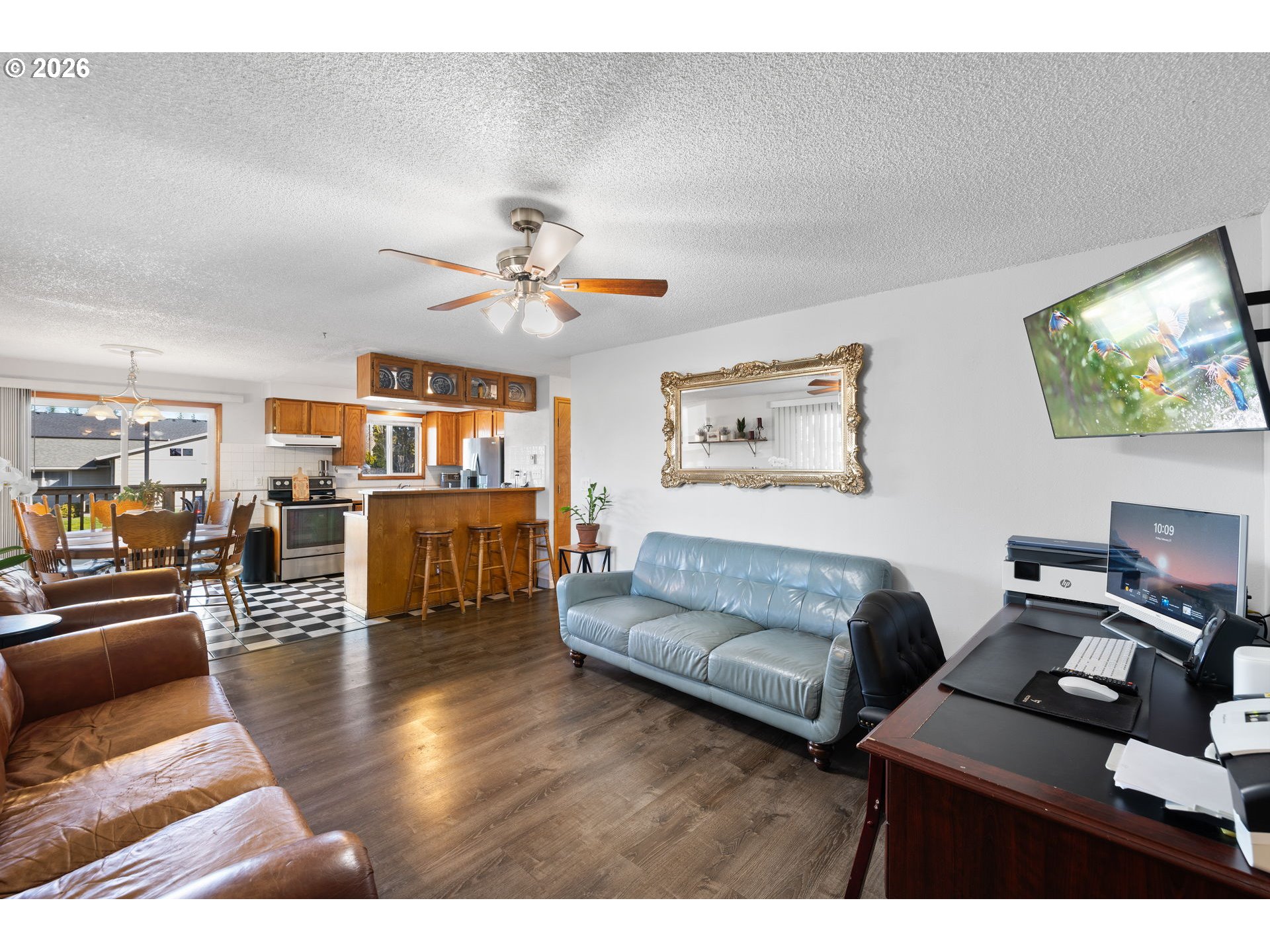 1480 Northeast Kane Drive Gresham, OR 97030 - Photo 6 of 46 a living room with furniture and a flat screen tv