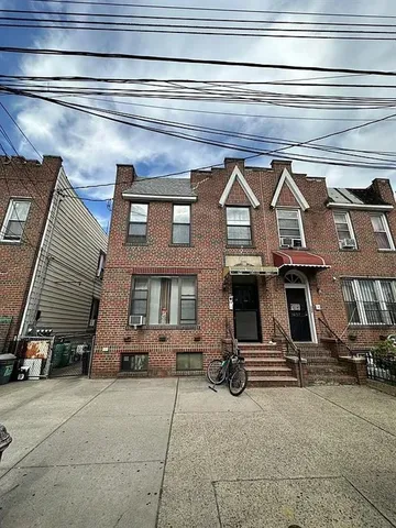 a view of a car park front of house