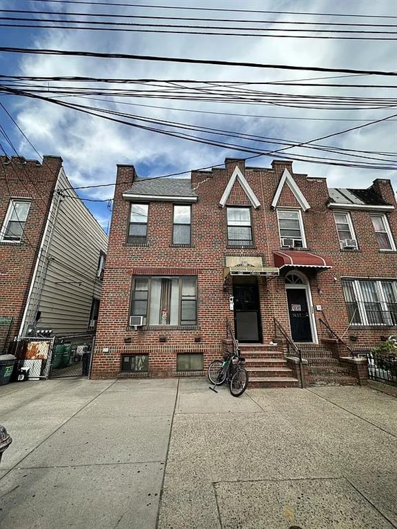 a view of a car park front of house