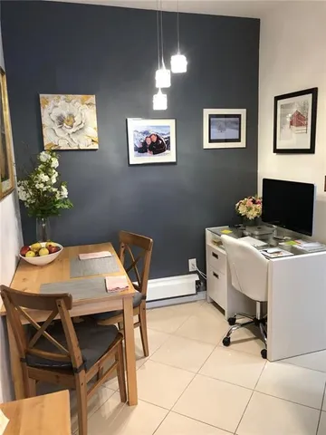 a workspace with furniture and window