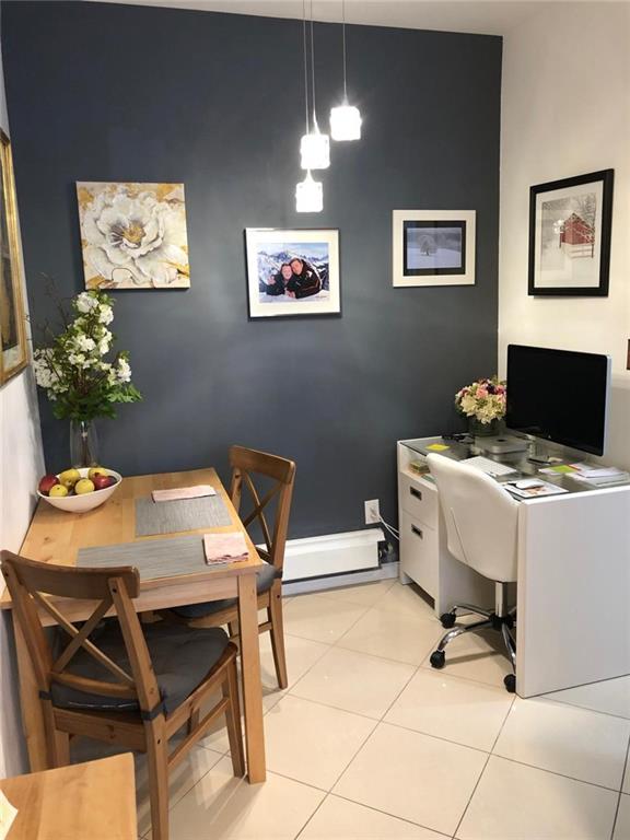 1635 83rd Street Brooklyn, NY 11214 - Photo 2 of 9 a workspace with furniture and window