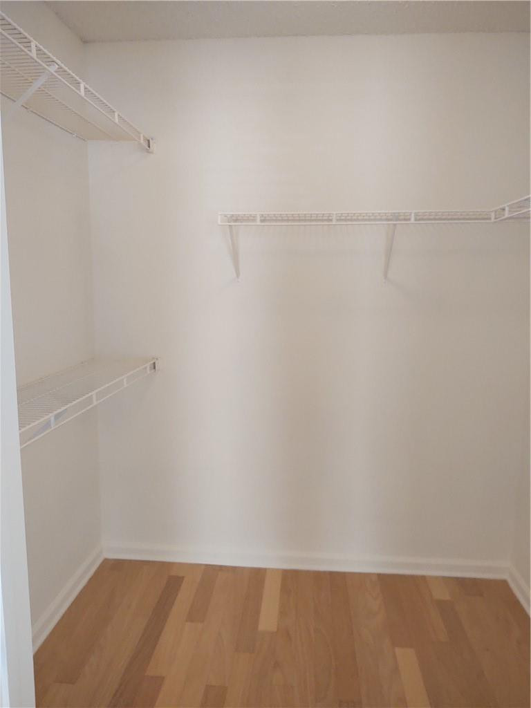 5801 Coach House Circle, Unit B Boca Raton, FL 33486 - Photo 19 of 39 Master bedroom walk in closet