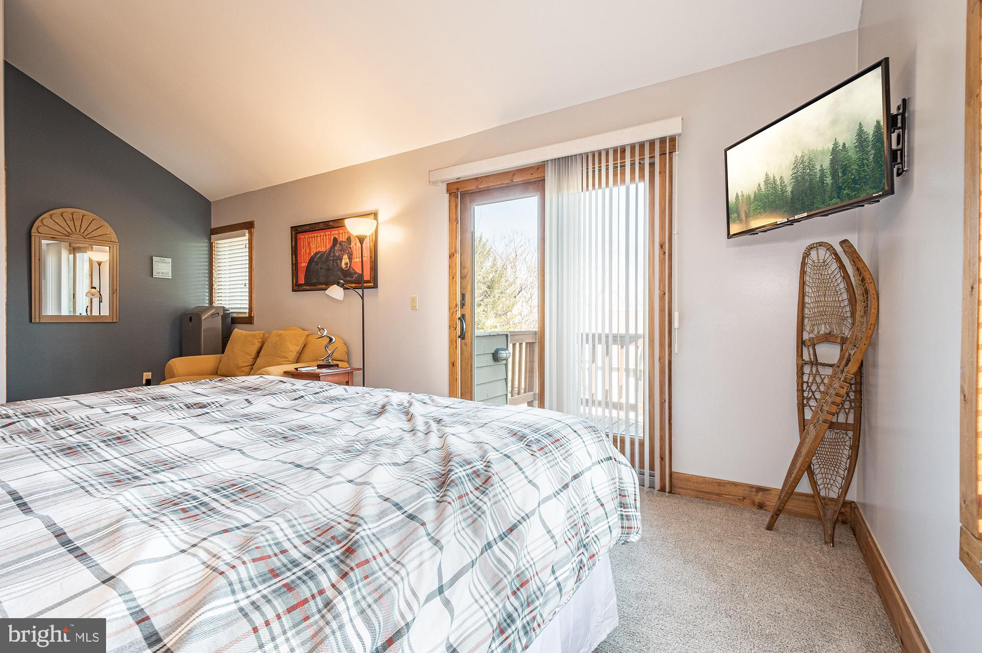 12 Winding Way, Unit 18A McHenry, MD 21541 - Photo 11 of 35 a bedroom with bed and wooden floor