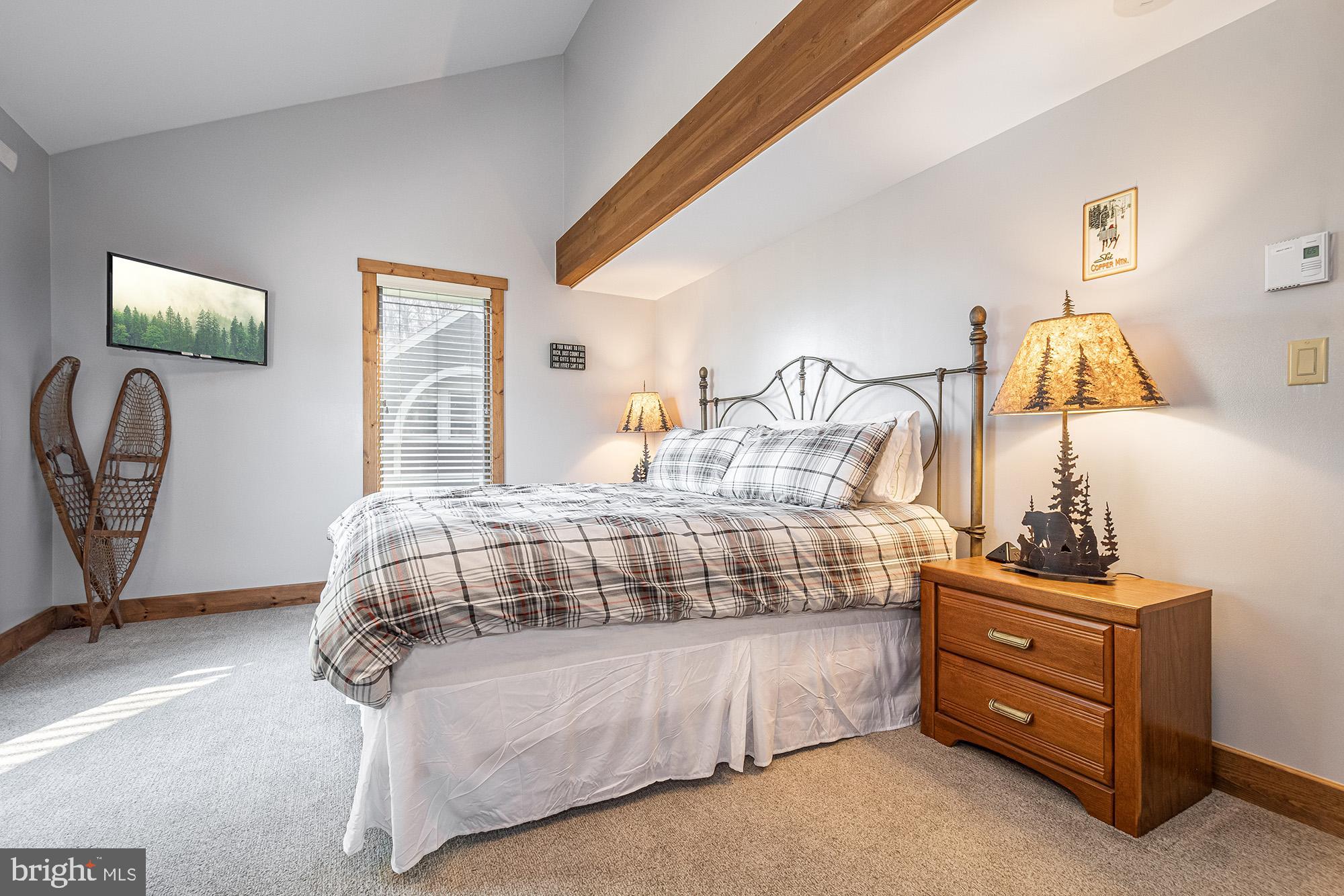 12 Winding Way, Unit 18A McHenry, MD 21541 - Photo 12 of 35 a bedroom with a bed and a dresser