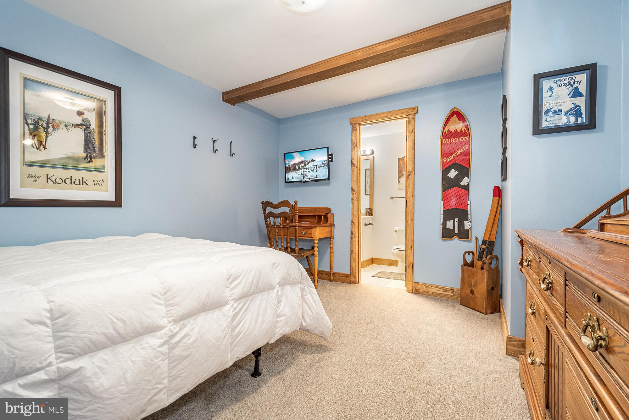 12 Winding Way, Unit 18A McHenry, MD 21541 - Photo 19 of 35 a bed room with a bed and a desk