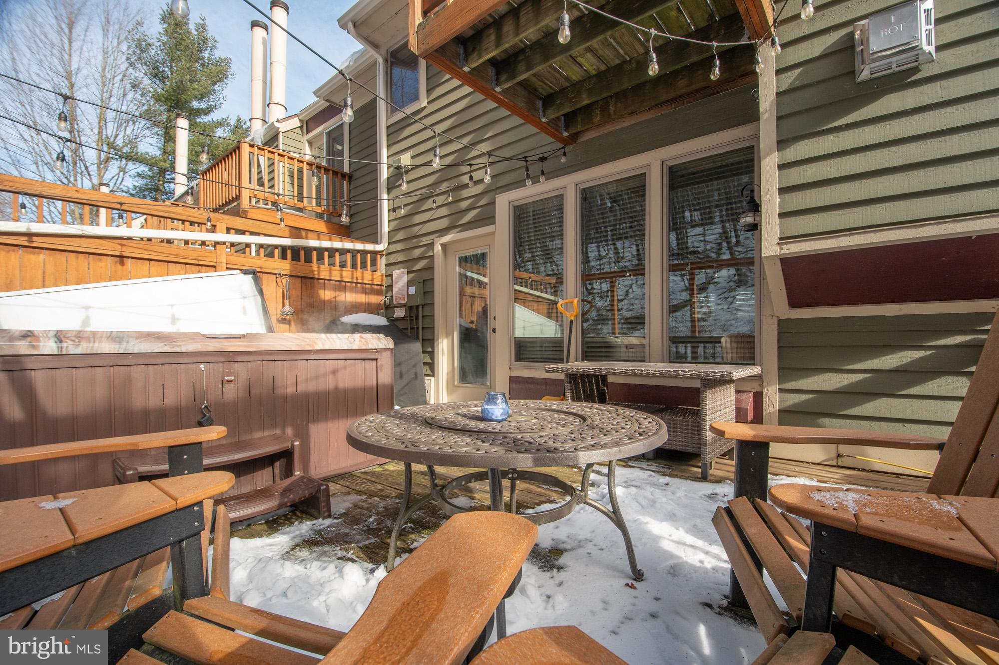12 Winding Way, Unit 18A McHenry, MD 21541 - Photo 26 of 35 a backyard of a house with outdoor seating