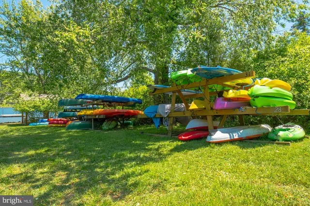 a view of a table and chairs under an umbrella