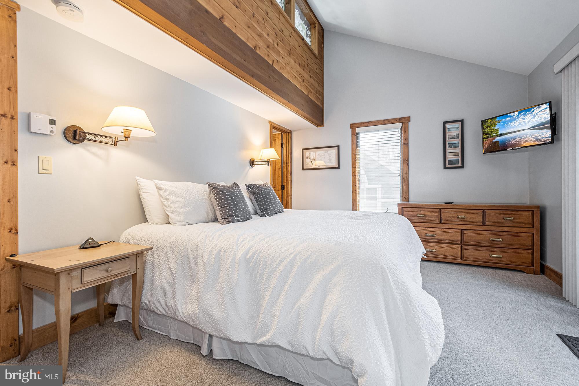 12 Winding Way, Unit 18A McHenry, MD 21541 - Photo 10 of 35 a bedroom with a bed and a couch