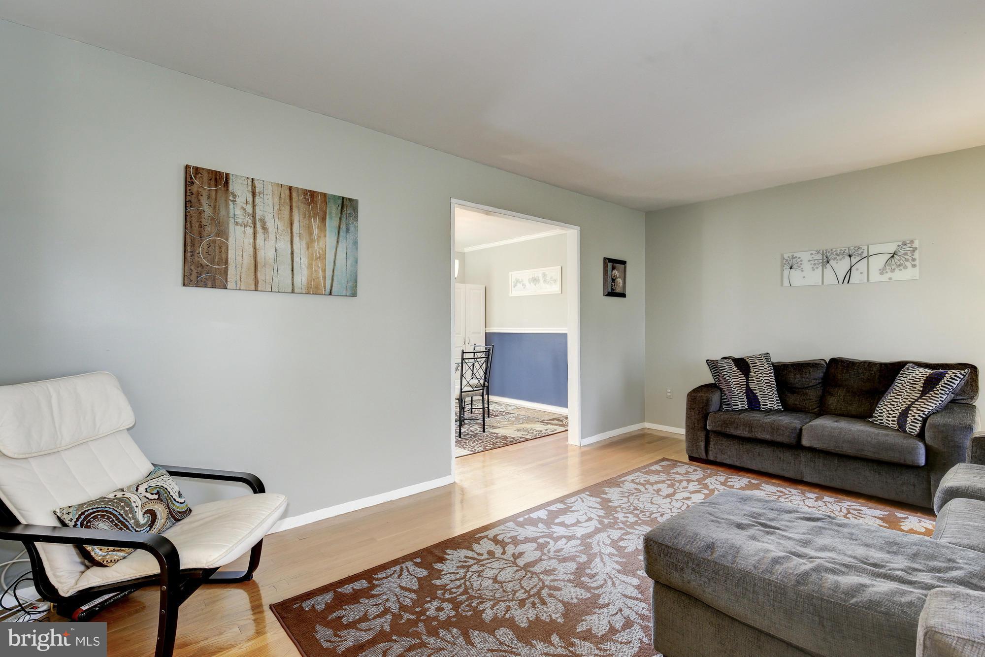 6505 Darwin Road Laurel, MD 20707 - Photo 2 of 30 a living room with furniture and wooden floor