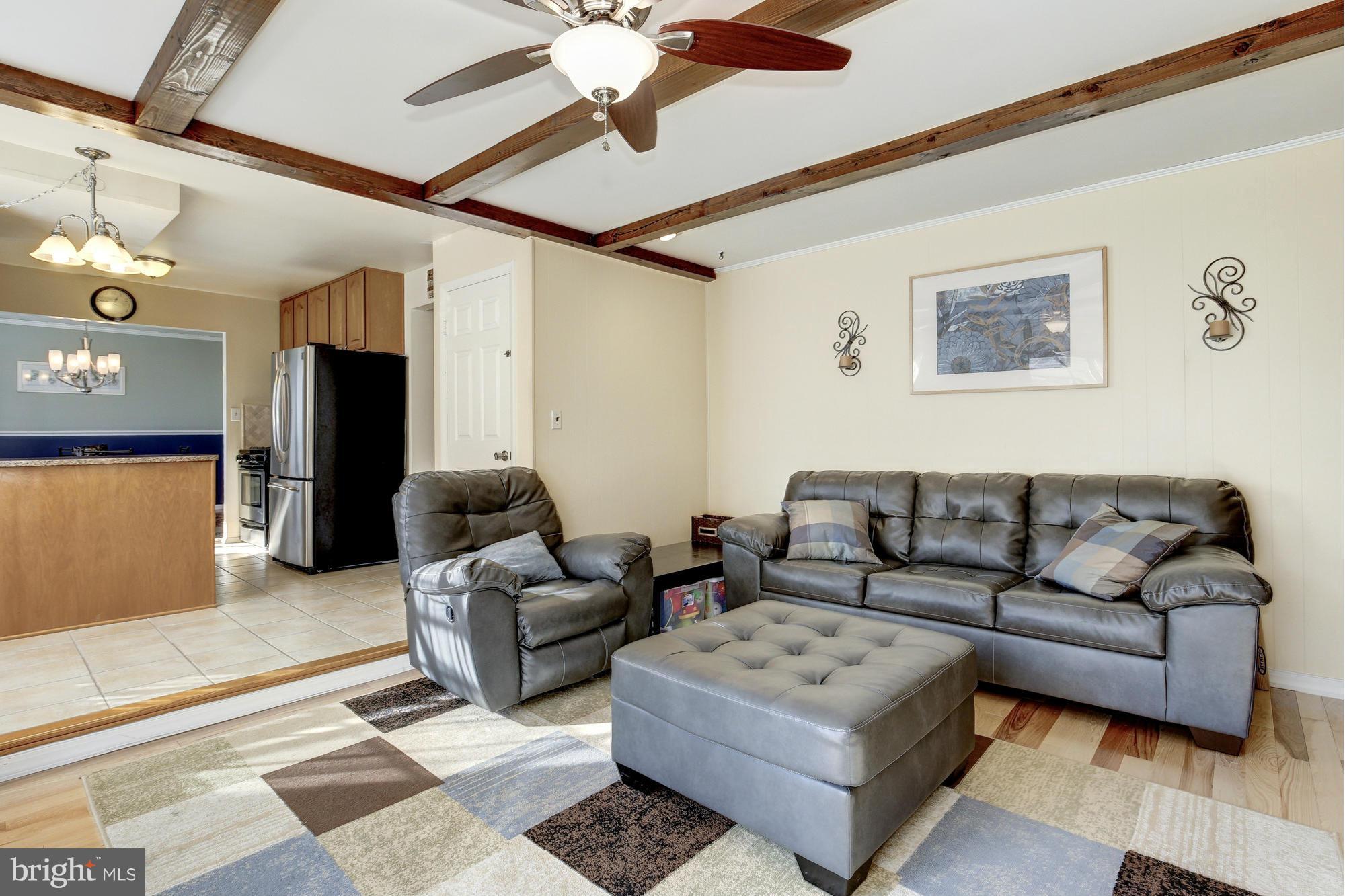 6505 Darwin Road Laurel, MD 20707 - Photo 12 of 30 a living room with furniture and a ceiling fan