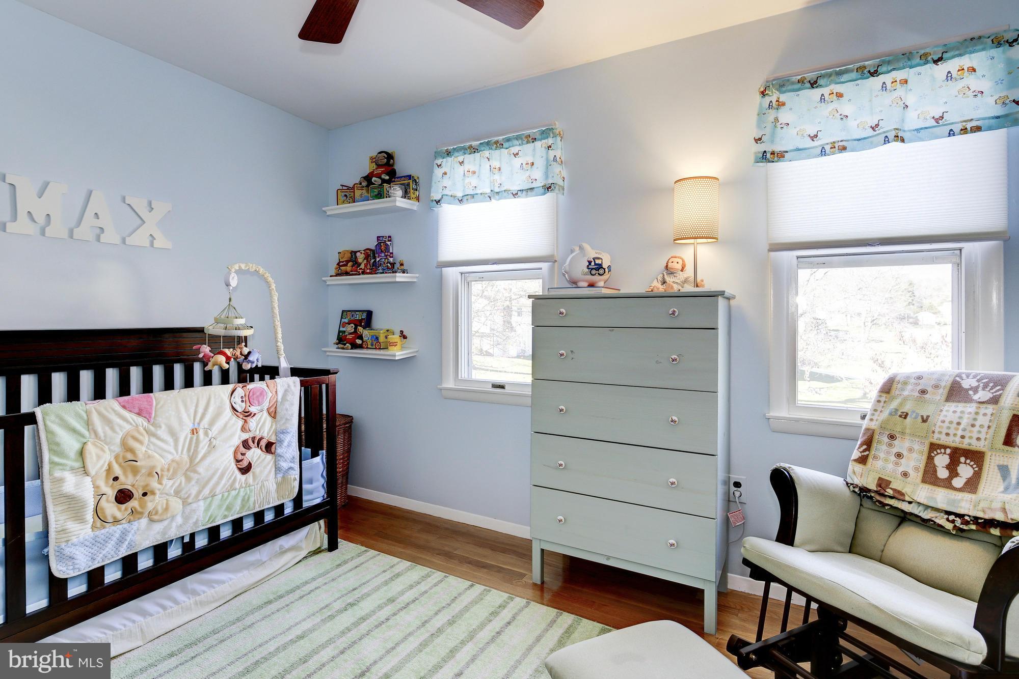 6505 Darwin Road Laurel, MD 20707 - Photo 21 of 30 a bedroom with a bed and a dresser