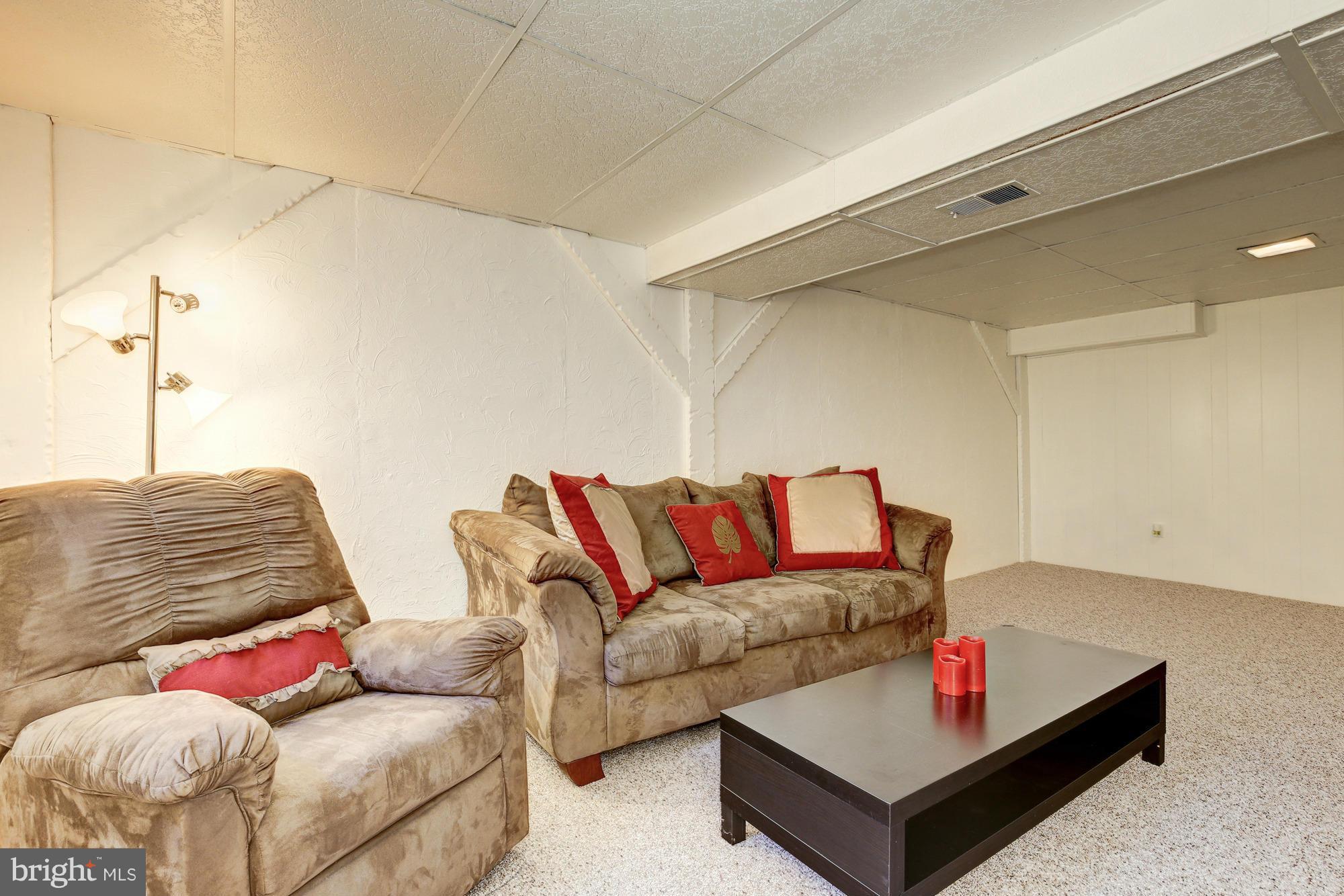6505 Darwin Road Laurel, MD 20707 - Photo 25 of 30 a living room with furniture and a couch