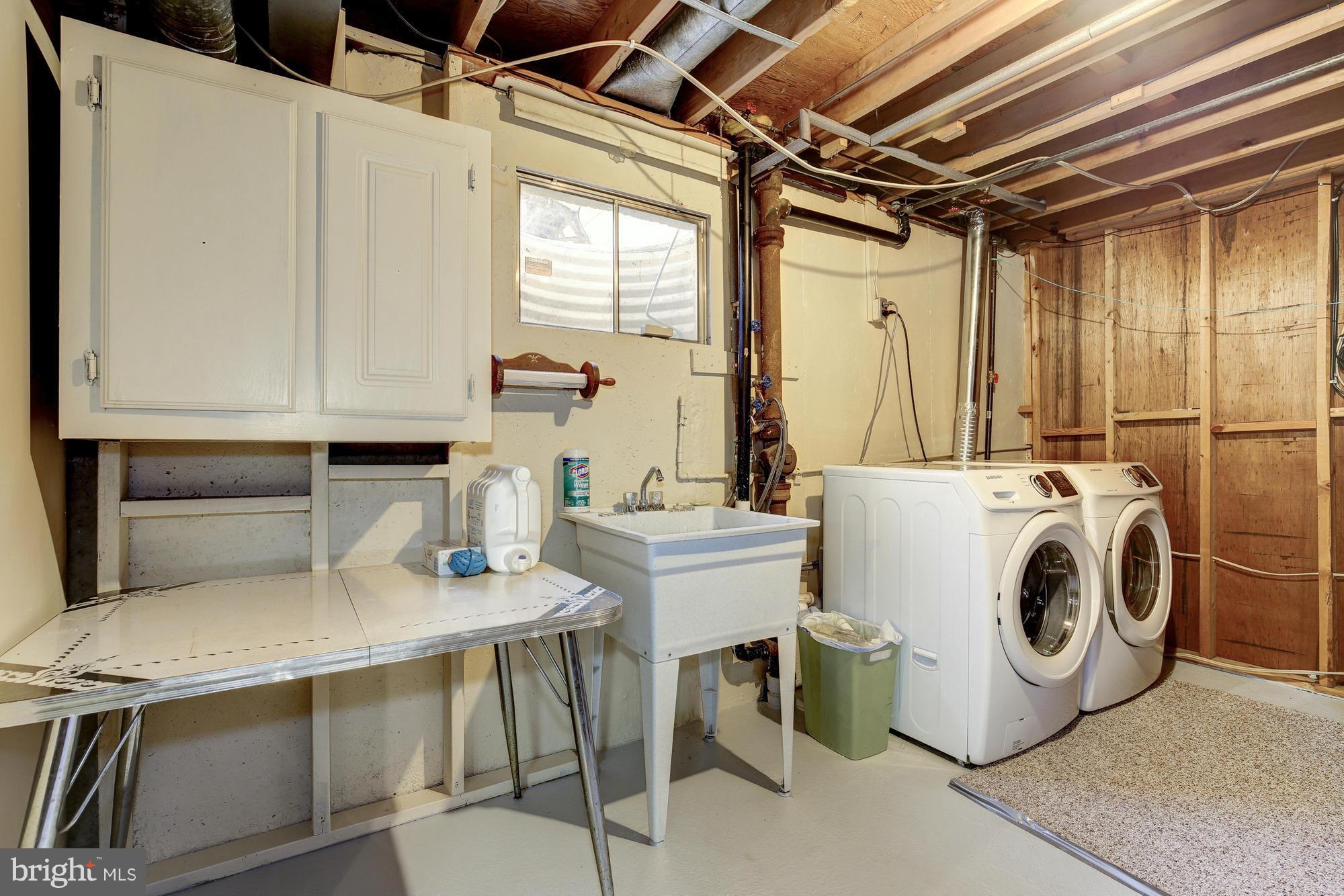 6505 Darwin Road Laurel, MD 20707 - Photo 27 of 30 a utility room with dryer and washer