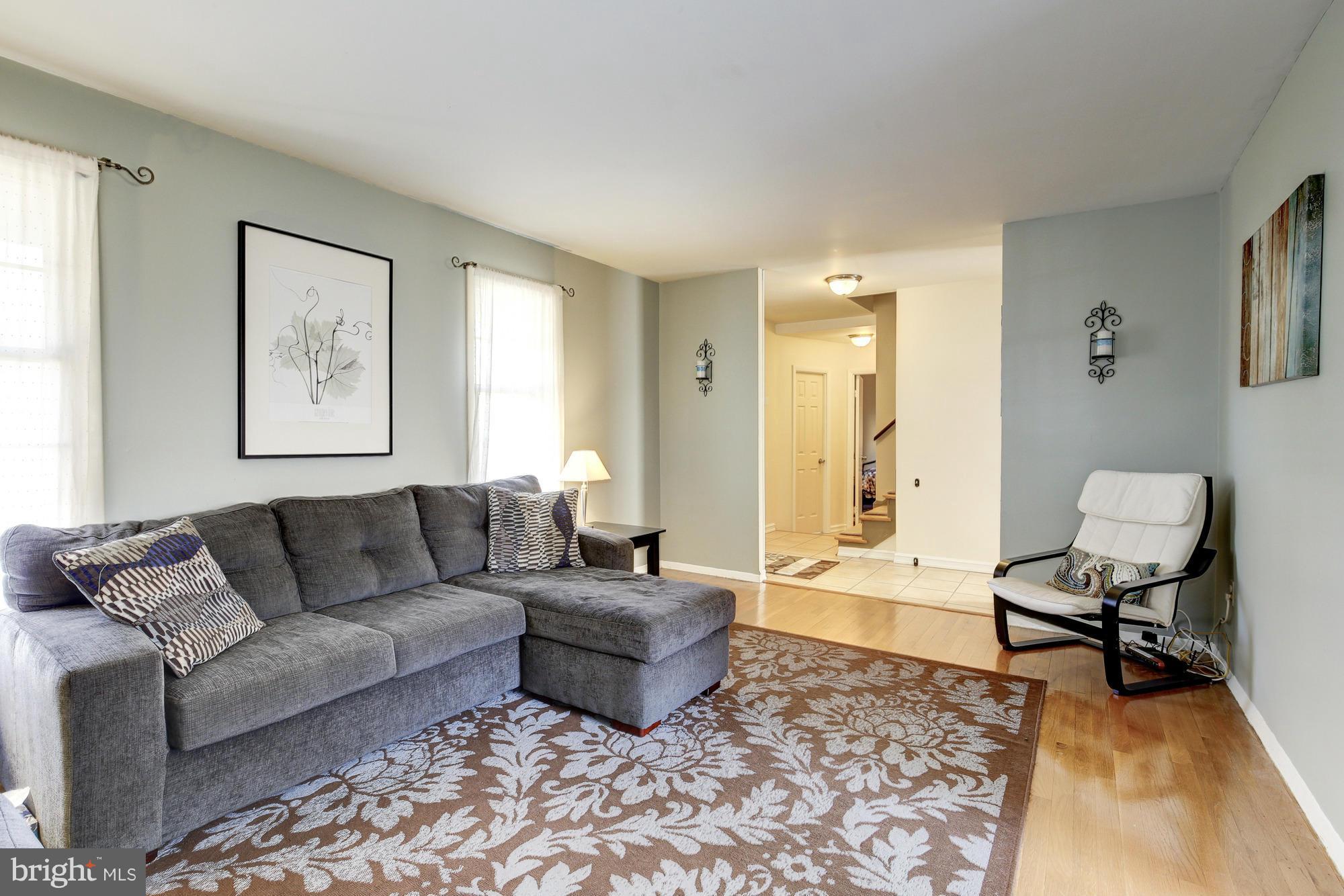 6505 Darwin Road Laurel, MD 20707 - Photo 4 of 30 a living room with furniture and a rug