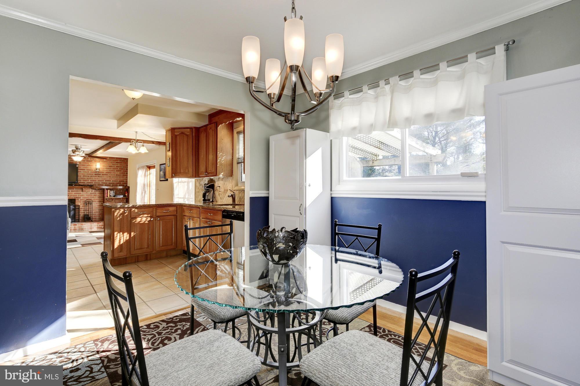 6505 Darwin Road Laurel, MD 20707 - Photo 6 of 30 a view of a dining room with furniture window and outside view