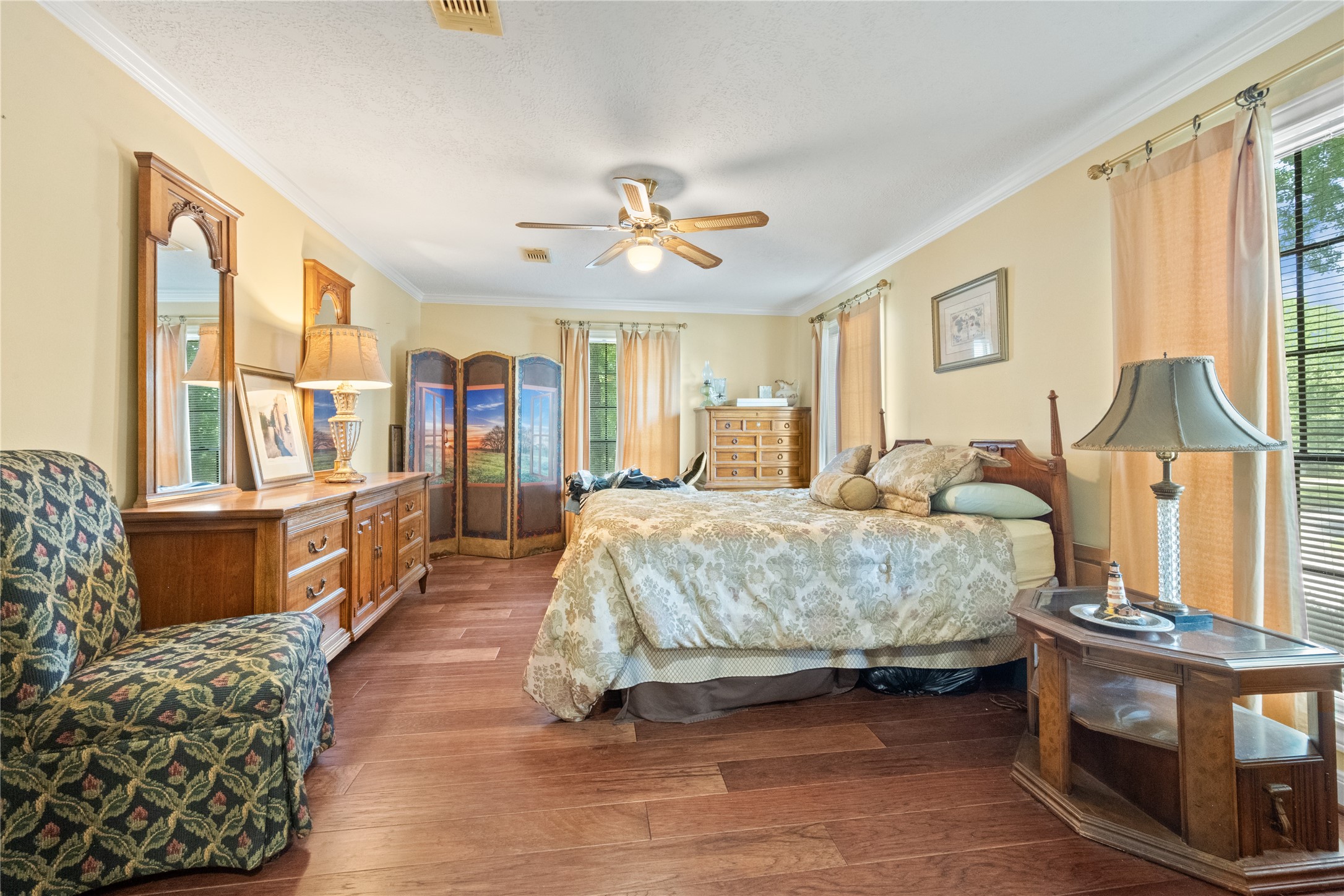 7639 Post Bridge Road Spring, TX 77389 - Photo 29 of 42 a spacious bedroom with a bed and wooden floor