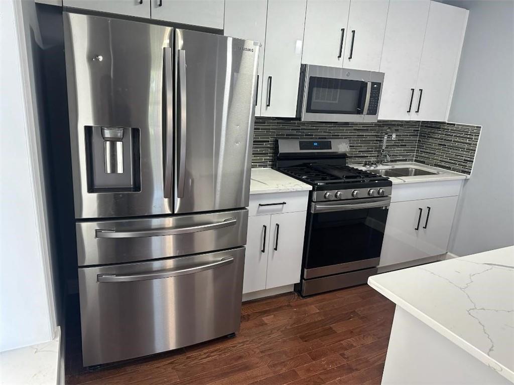 515 Connecticut Avenue Rochester, PA 15074 - Photo 6 of 20 a kitchen with stainless steel appliances granite countertop a refrigerator stove and microwave