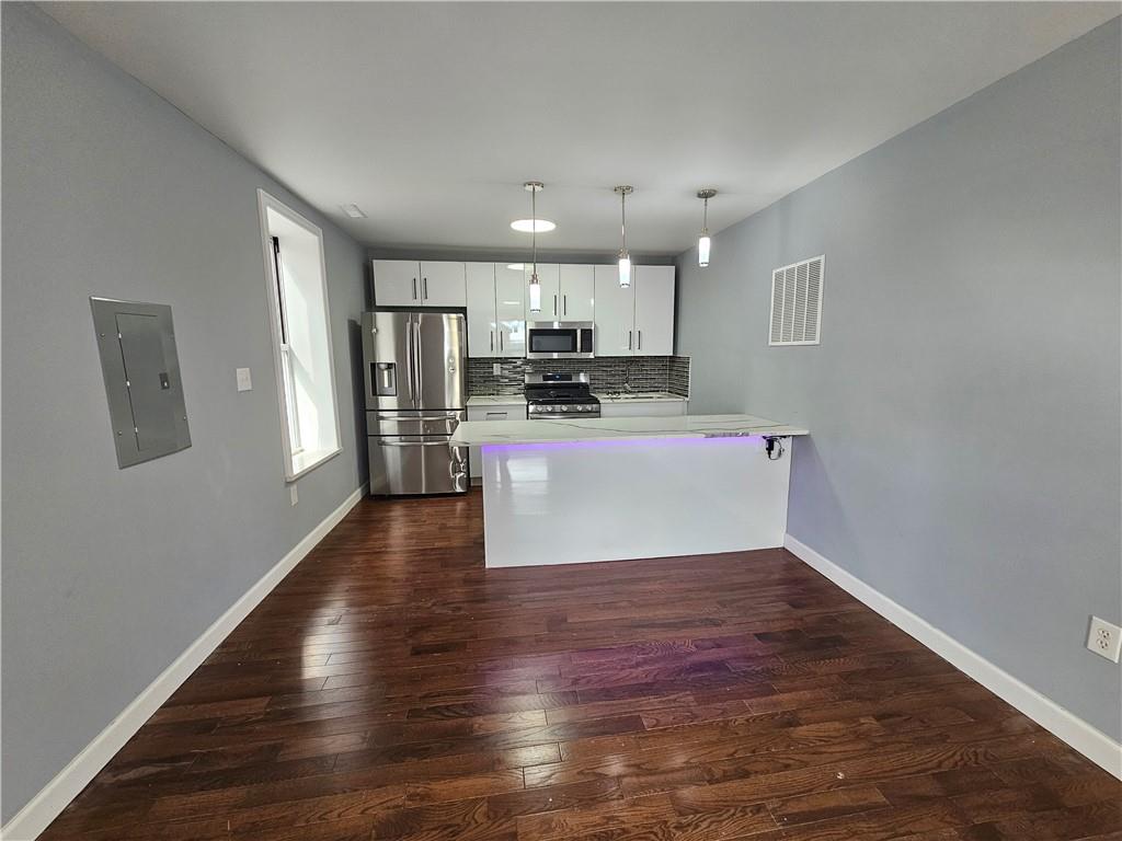 515 Connecticut Avenue Rochester, PA 15074 - Photo 8 of 20 a view of a kitchen with a sink and wooden floor