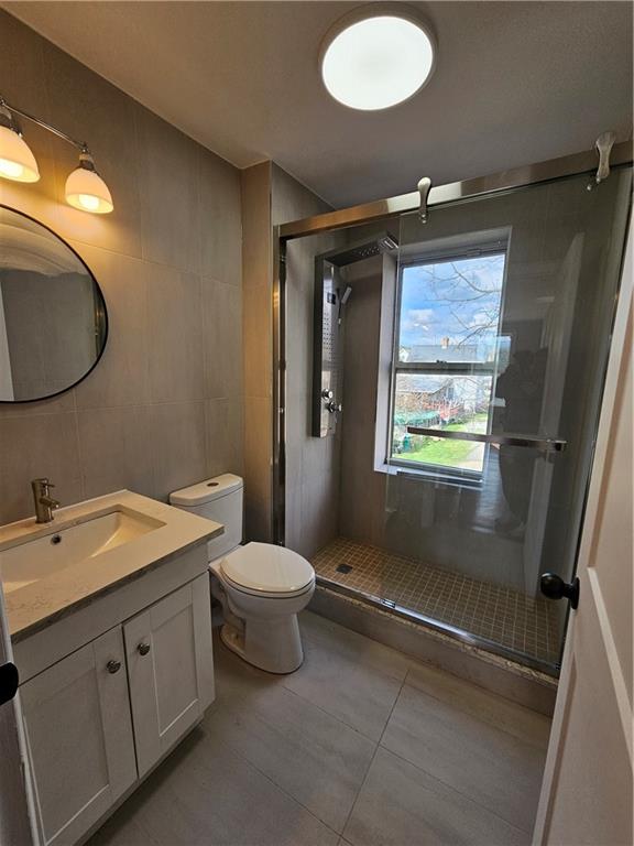 515 Connecticut Avenue Rochester, PA 15074 - Photo 10 of 20 a bathroom with a toilet sink and mirror