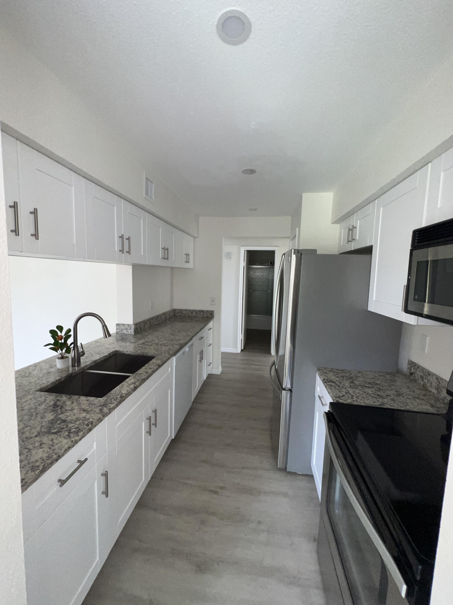 899 Riverside Drive, Unit 620 Coral Springs, FL 33071 - Photo 13 of 46 a large kitchen with a stove and a refrigerator