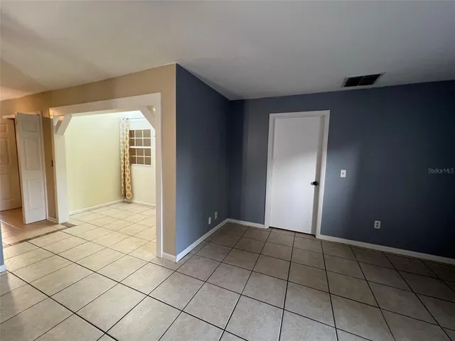 a view of an empty room and window
