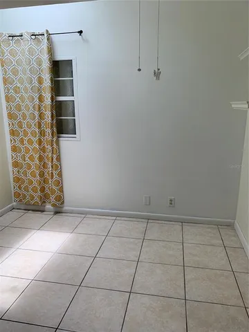 a view of an empty room with a bathroom