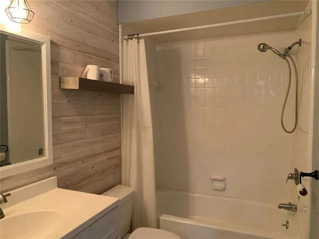 a bathroom with a shower and a tub