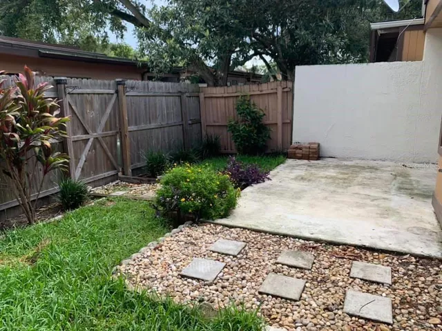 a backyard of a house with lots of green space