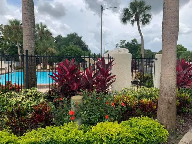a view of a potted flower in a garden next to a building