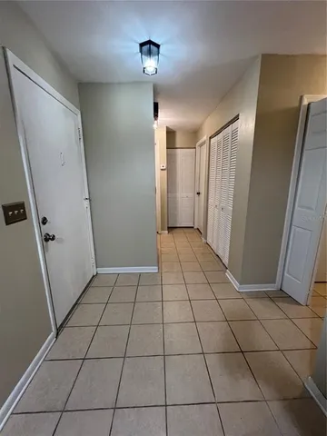 a view of a livingroom with an empty space and a window