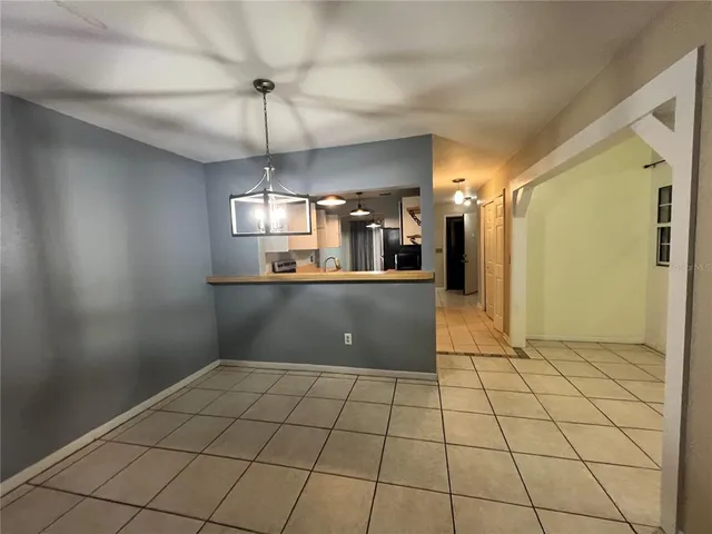 a view of a kitchen with a sink and cabinets